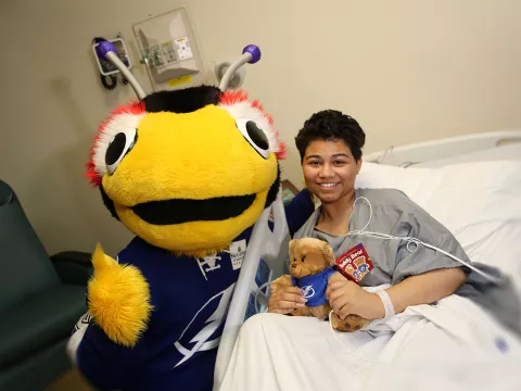 Lightning Mascot with kid in hospital