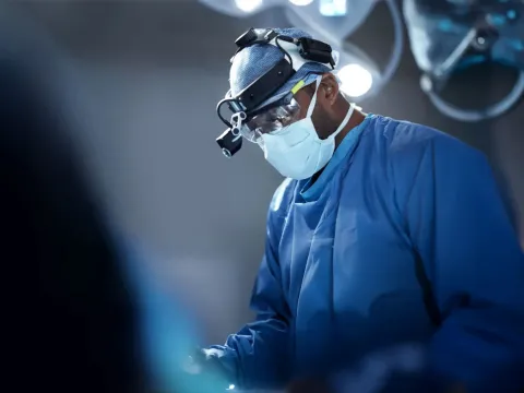 physician performing surgery