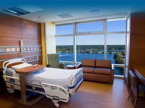 Hospital room with a view of a lake or river
