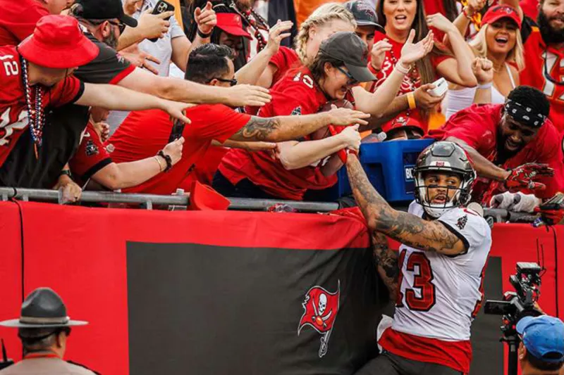 bucs player jumping into crowd