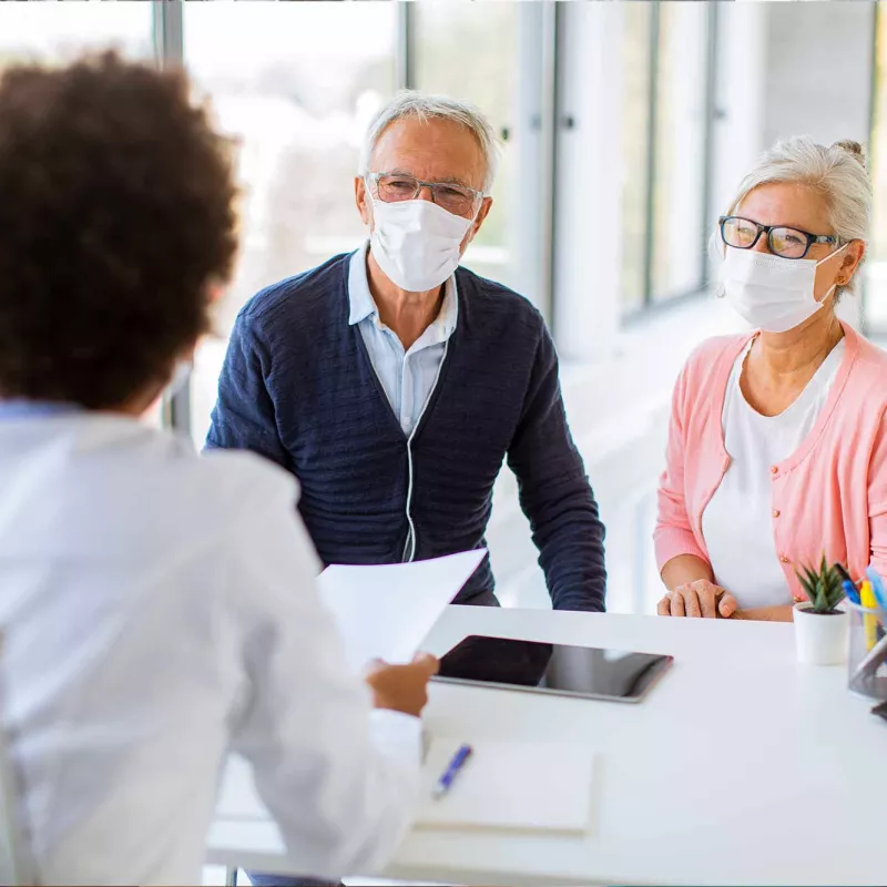 LP-50-50-insert-west-cv-vascular-Senior-couple-with-doctor-in-office