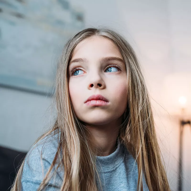 preteen girl looking up