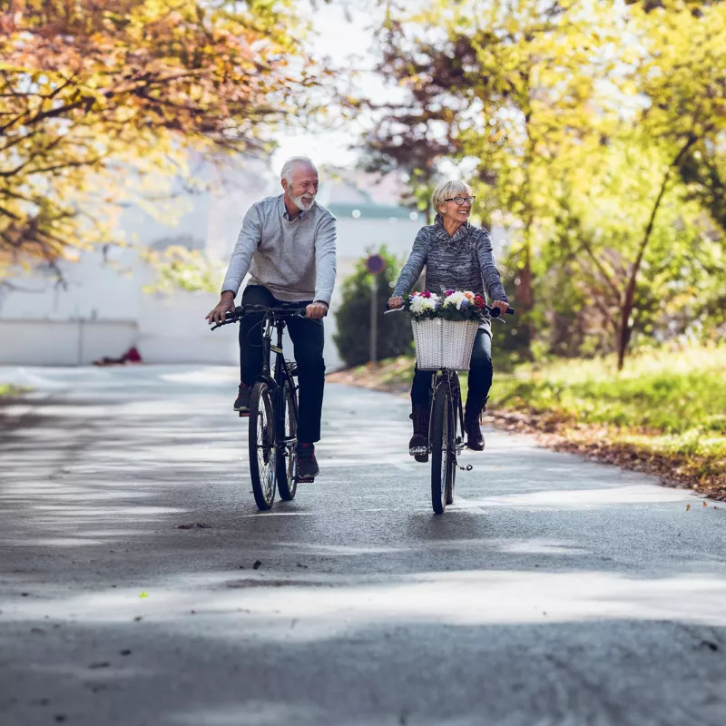 elder-couple-riding-a-bike