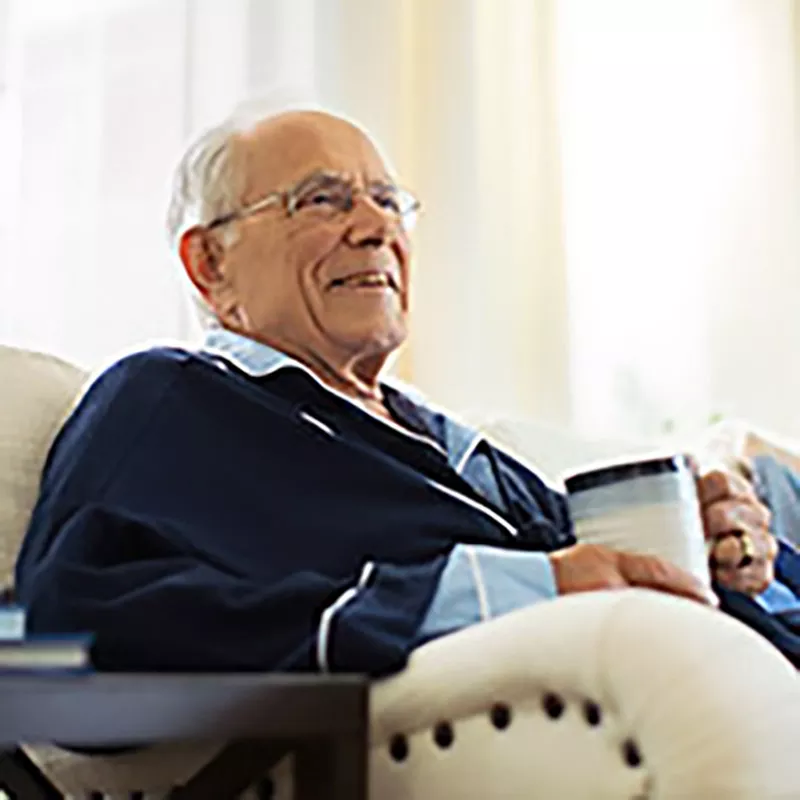 older-man-seating-and-drinking-coffee