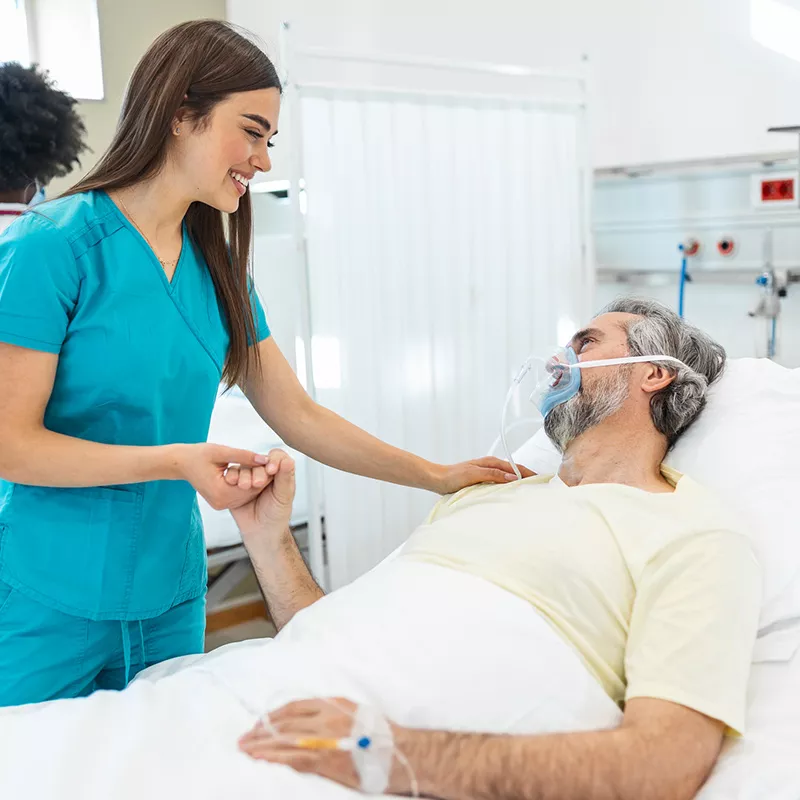 nurse-talking-to-a-patient-in-bed