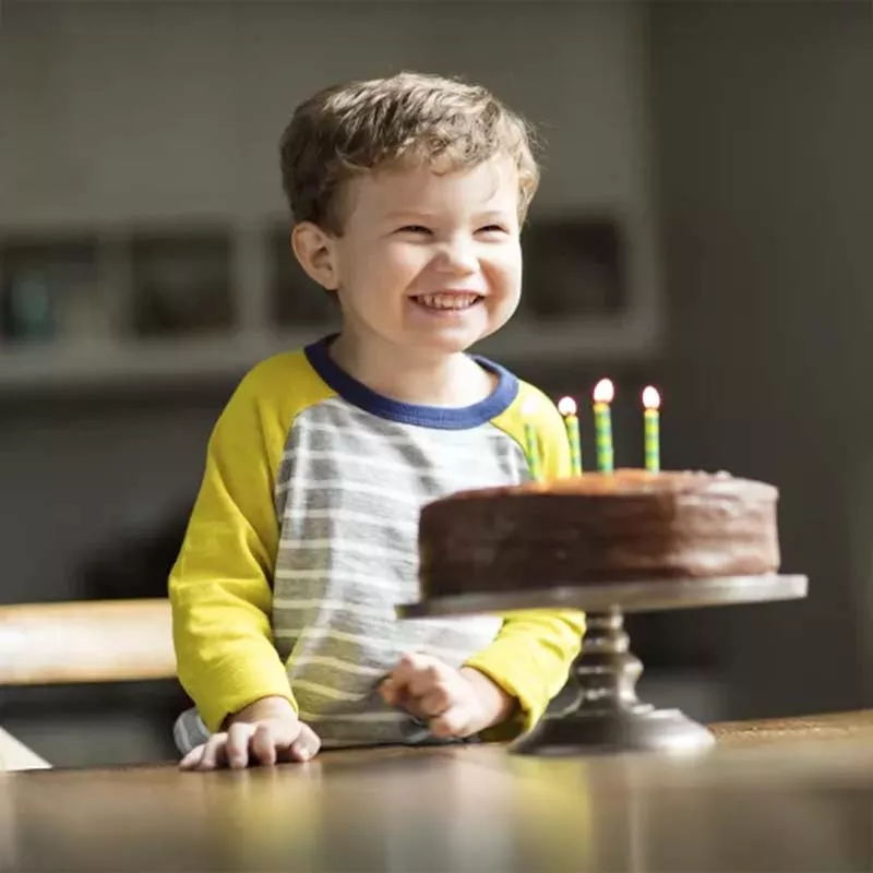 Boy excited about his birthday cake