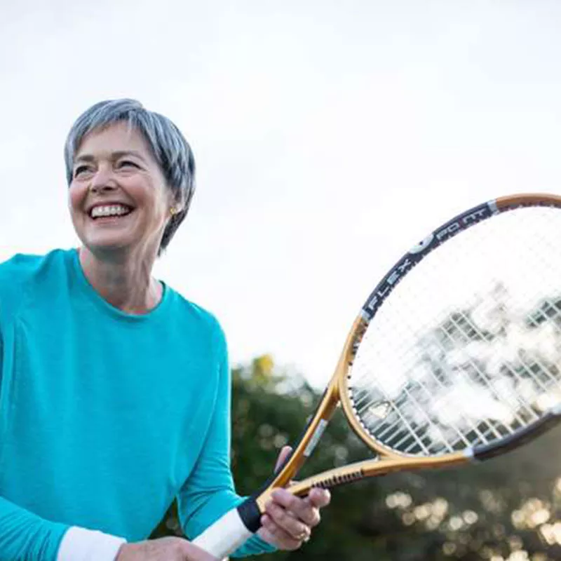 older-woman-playing-tennis