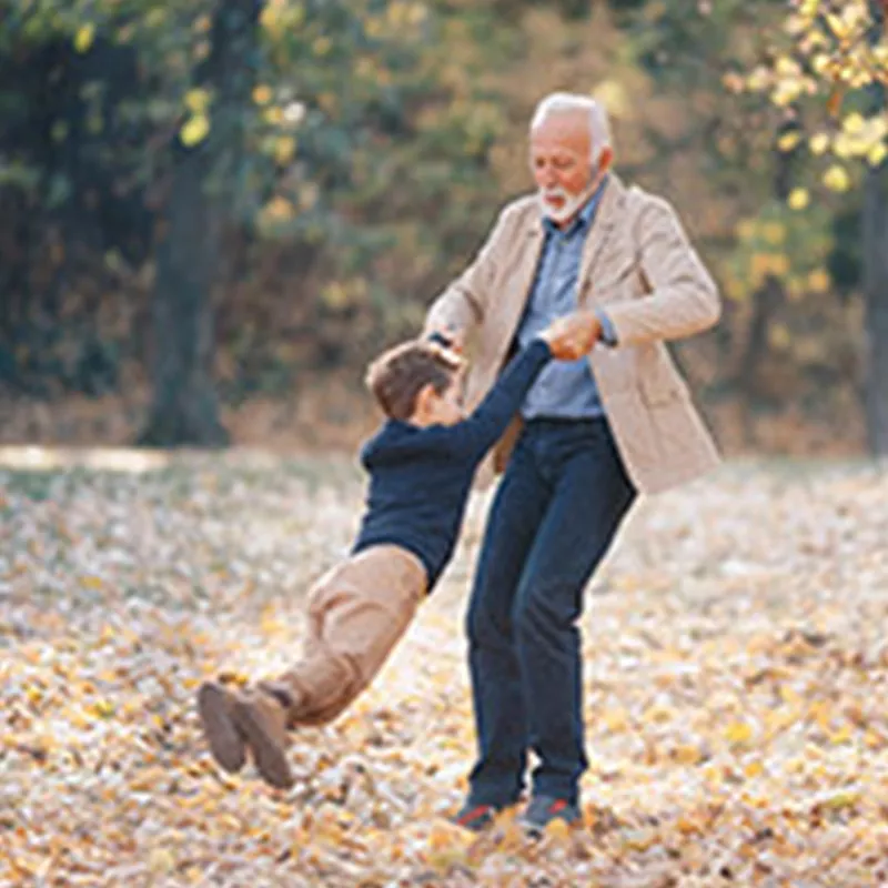 grandfather-and-grandson-playing-outdoors