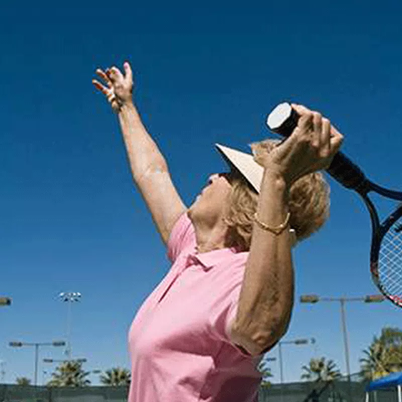 older-woman-playing-tennis