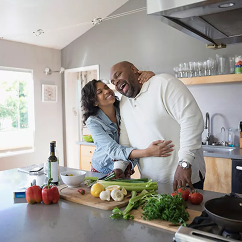 couple-laughing-in-the-kitchen