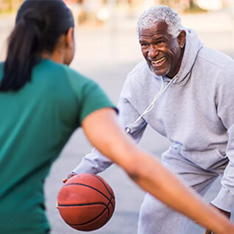 man-playing-basketball with his daughter