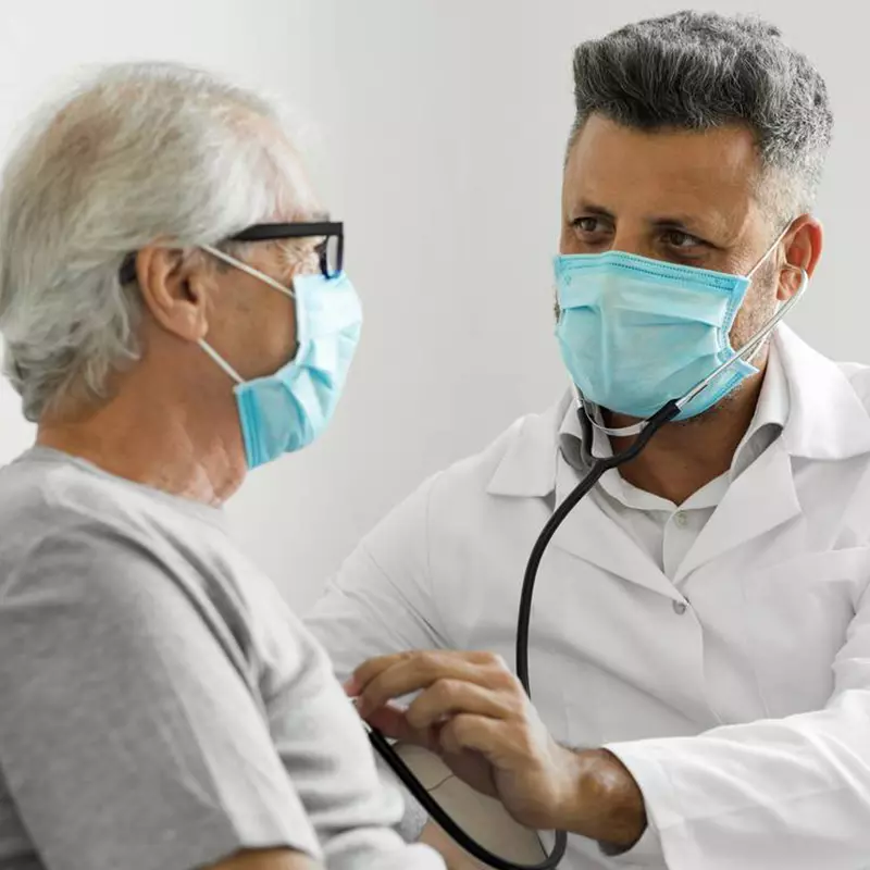 LP-Circle-Insert-Large-Digestive-General-Texas-Doctor-checking-elderly-patient-wearing-facemask