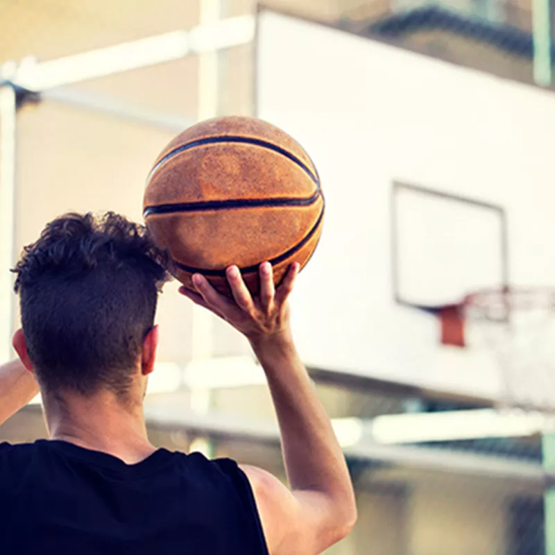Man-playing-basketball-sports-medicine