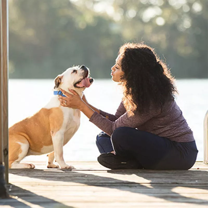 young-woman-with-a-dog-outdoors