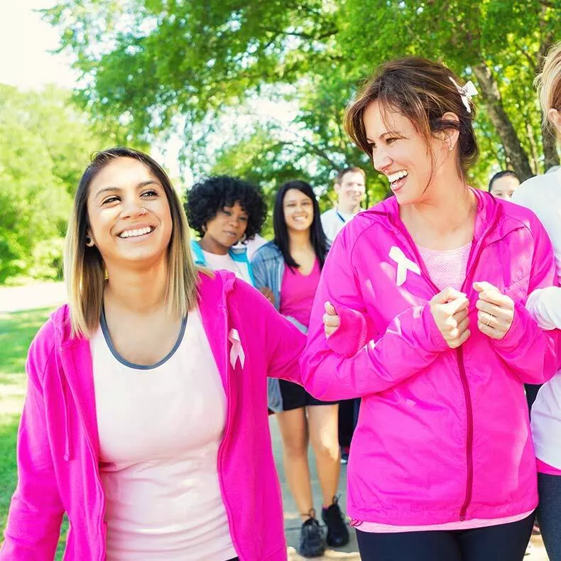 two-female-friends-walking-wearing-pink