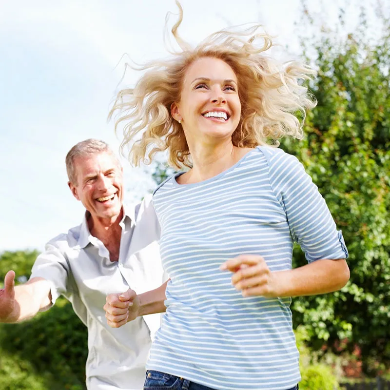 older couple running and smiling