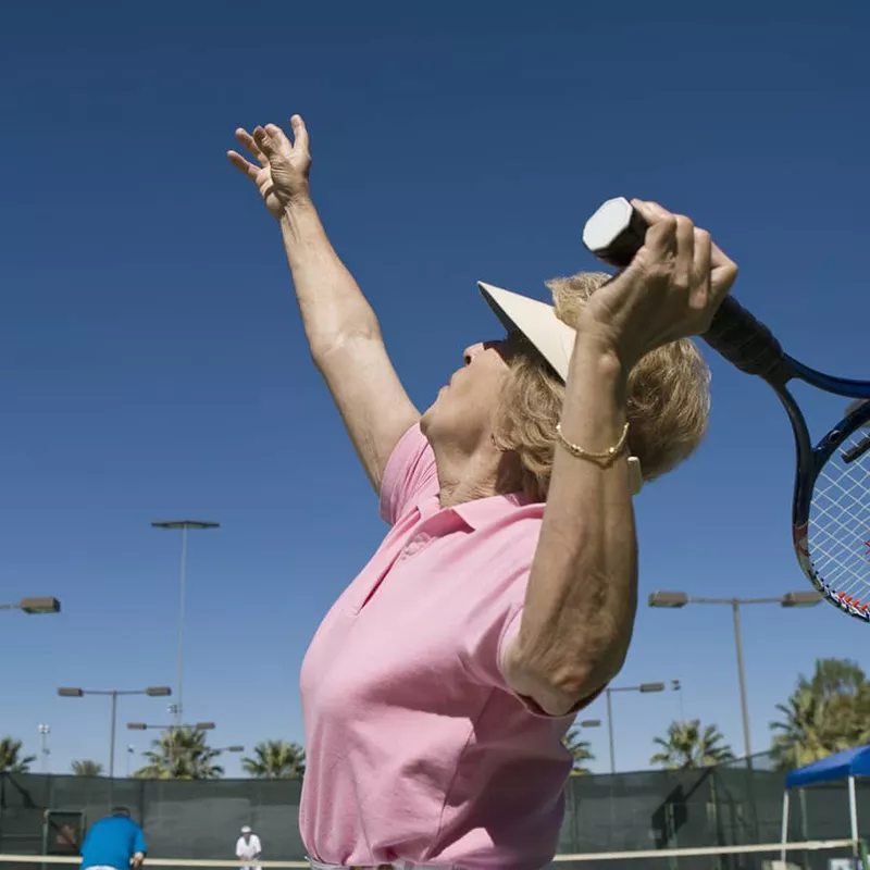 older-woman-playing-tennis