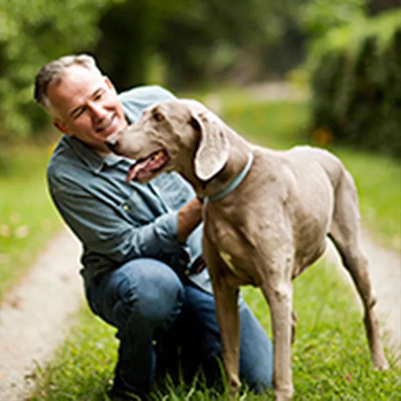 LP-Circle-Insert-Large-WestFL-Neuro-brain-tumor-man-with dog-outdoors