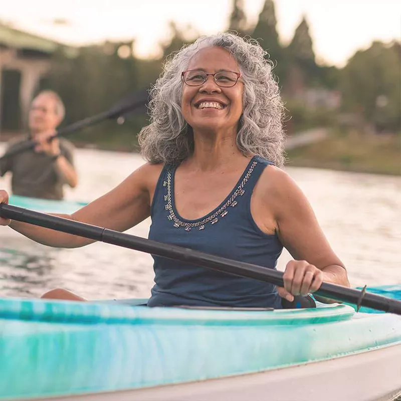 happy-woman-in-a-kayak