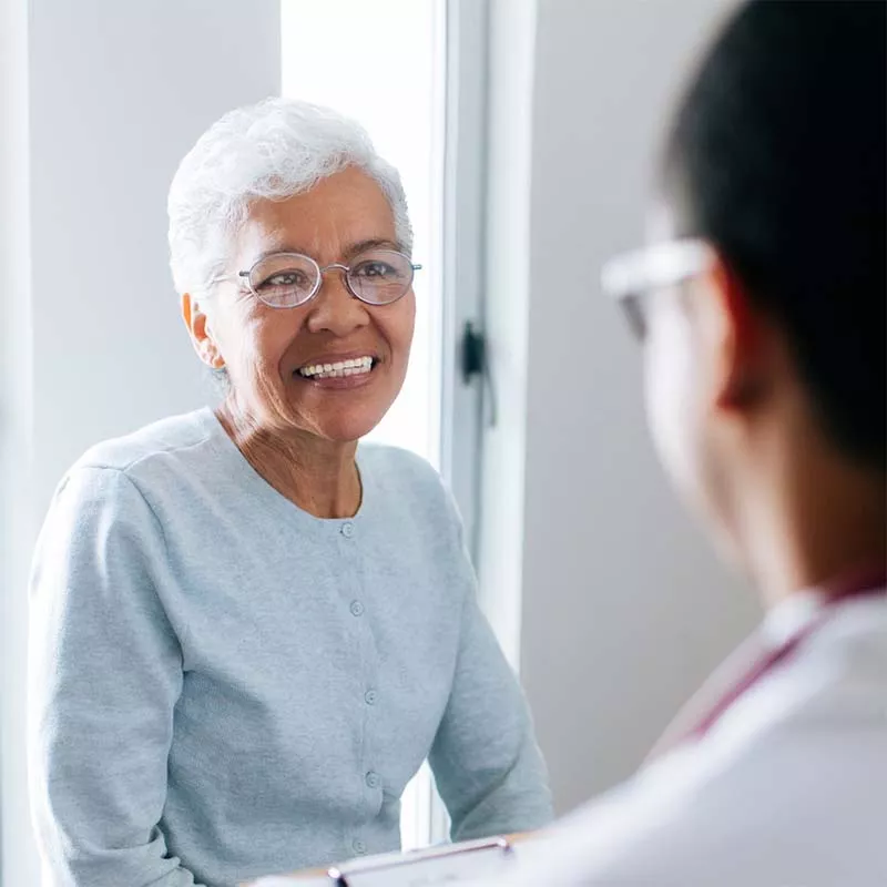 Older female patient with doctor