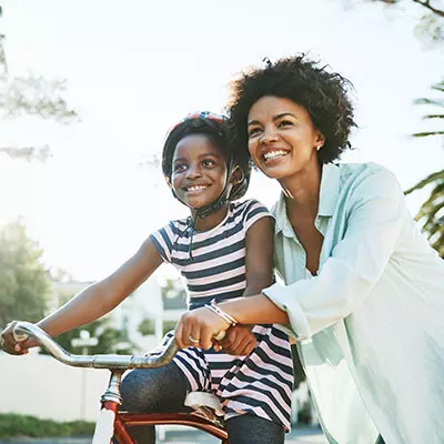 LP-Circle-Insert-Small-central-pediatrics-neuro-woman-with-daughter-riding-bike