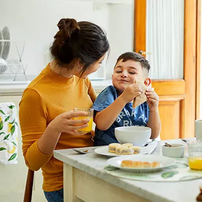 LP-Circle-Insert-Small-central-pediatrics-neuro-Woman-with-son-having-breakfast-at-home