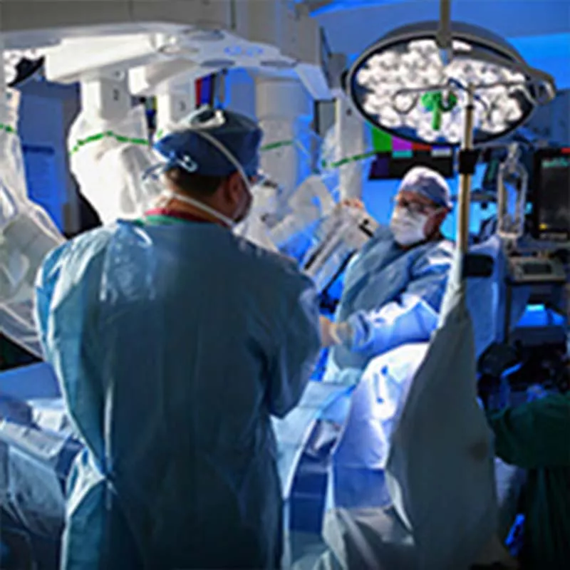 Surgeons performing operation in operating room