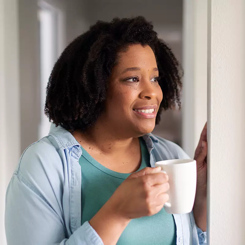 woman drinking coffee at home