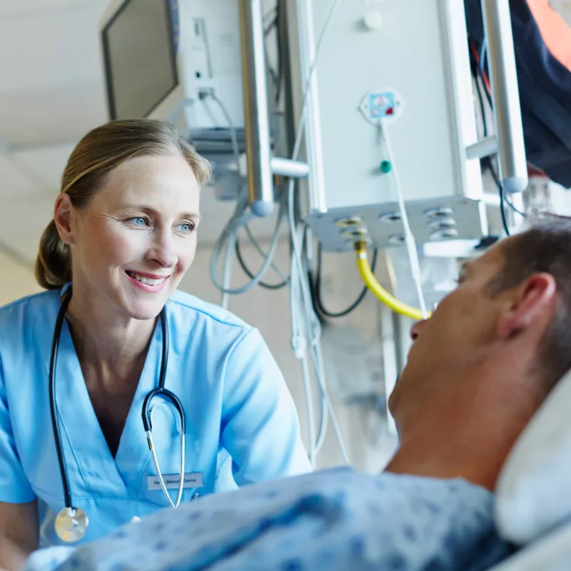 doctor-talking-to-patient and smiling