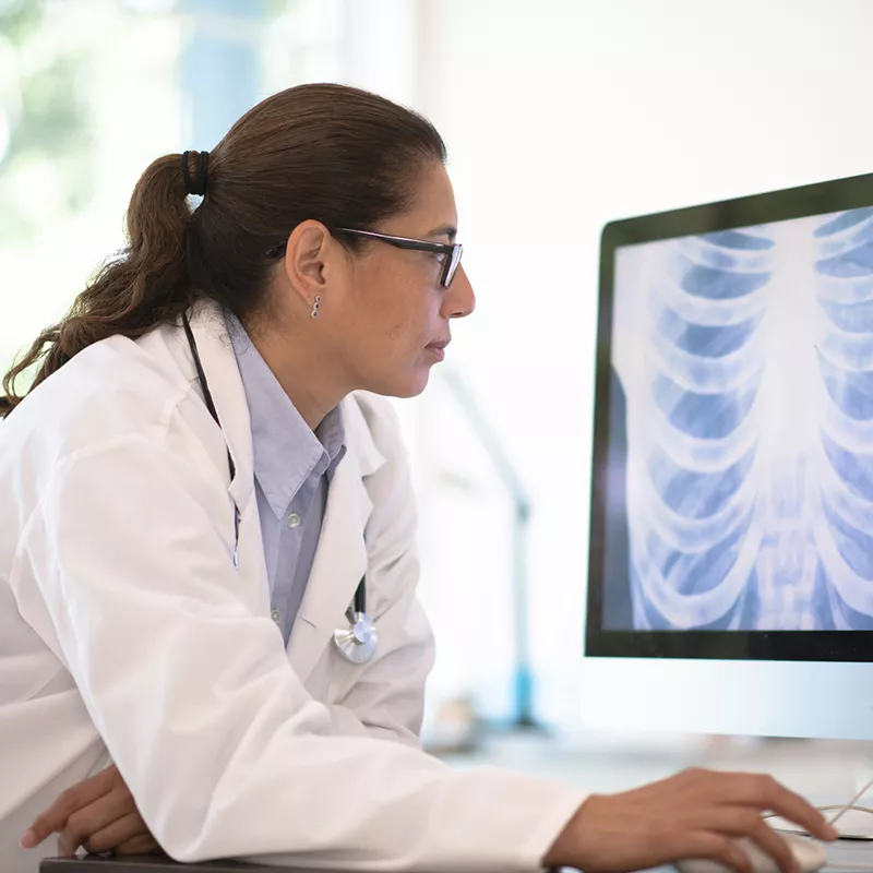 a-physician-looking-at-a computer-screen