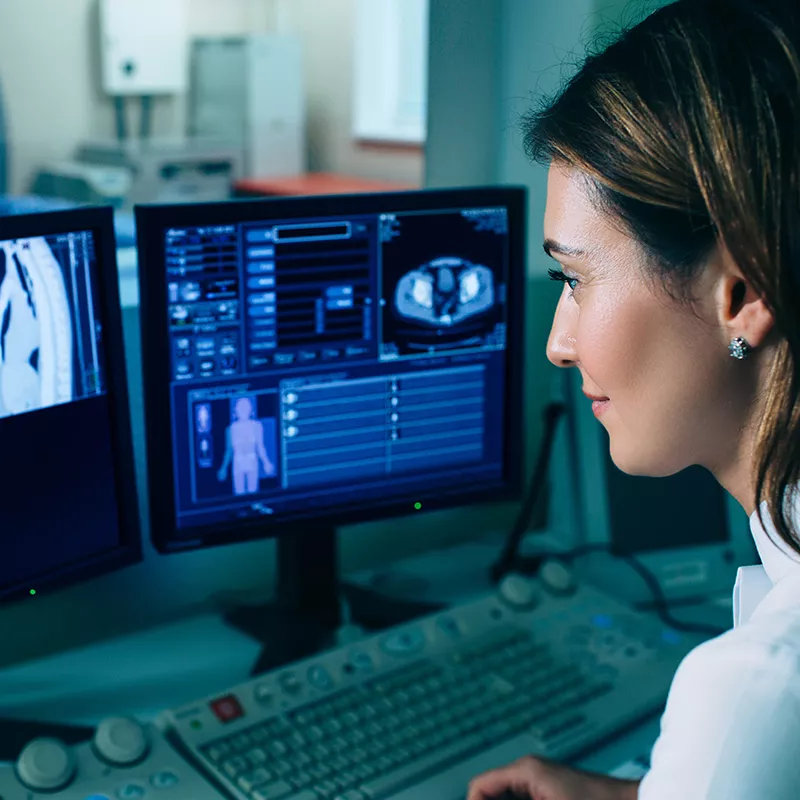 technician looking at a CT
