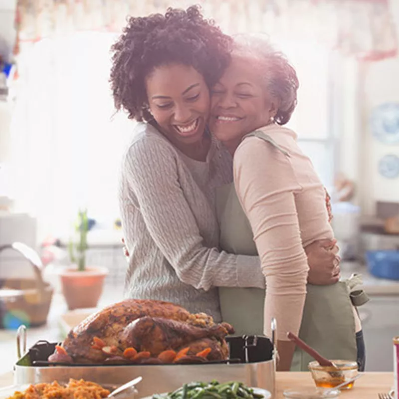 women-hugging-and-smiling