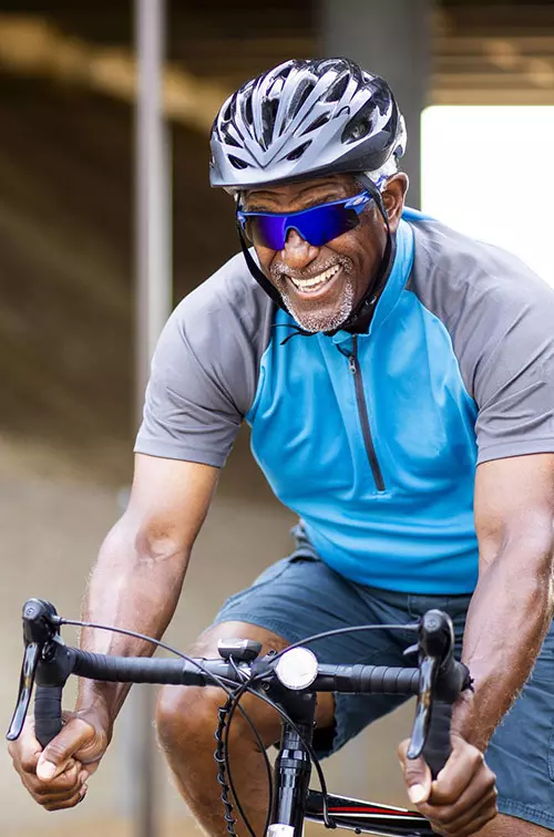 LP-Hero-Desktop-west-cv-vascular-senior-black-man-riding-bike