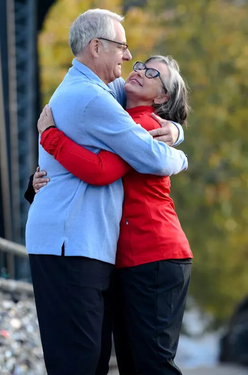 Couple embracing on bridge