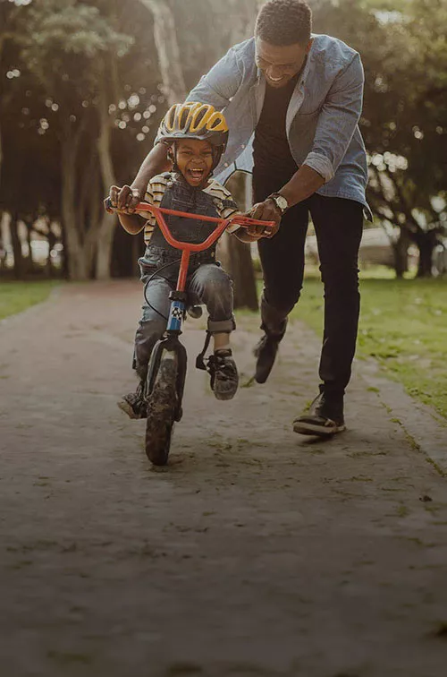 father-teaches-his-son-to-ride-a-bike