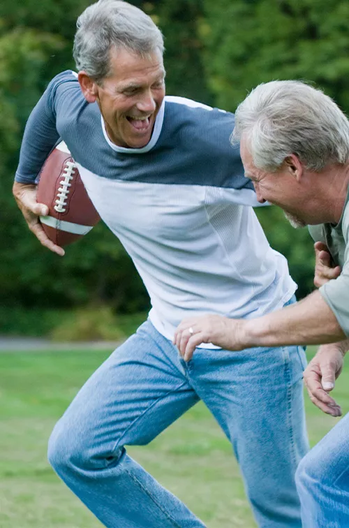 men playing backyard football