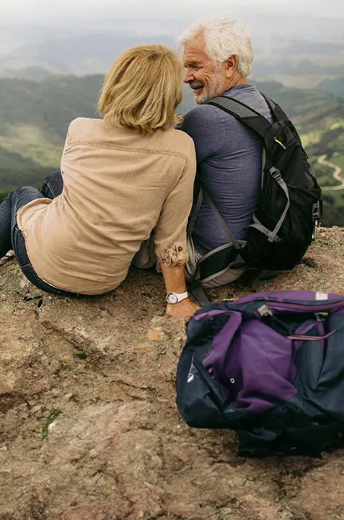 older-couple-atop-a-mountain