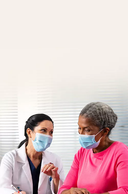 a-physician-and-a-patient-wearing-facemasks