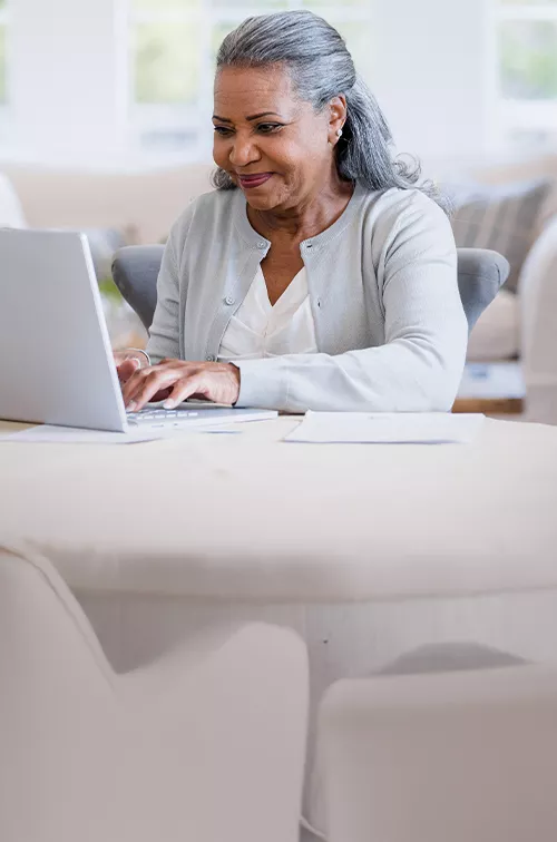 A woman using her computer at home