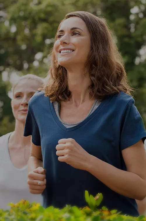 women-jogging-and-smiling