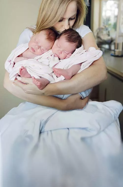 Woman holding twins