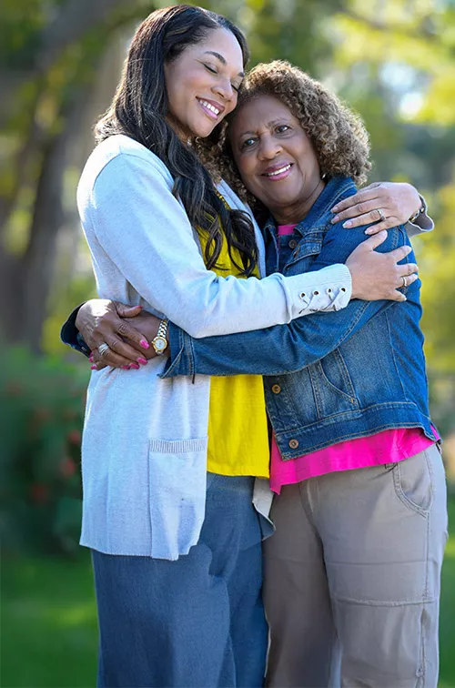 mom and daughter happy hugging