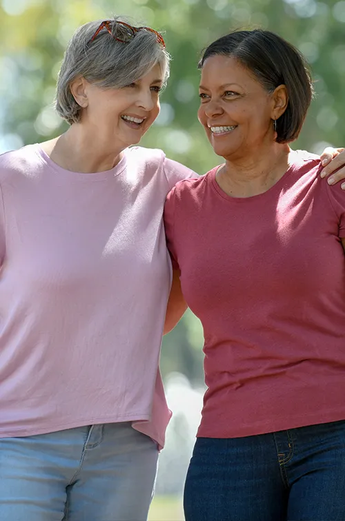 two women talking in park
